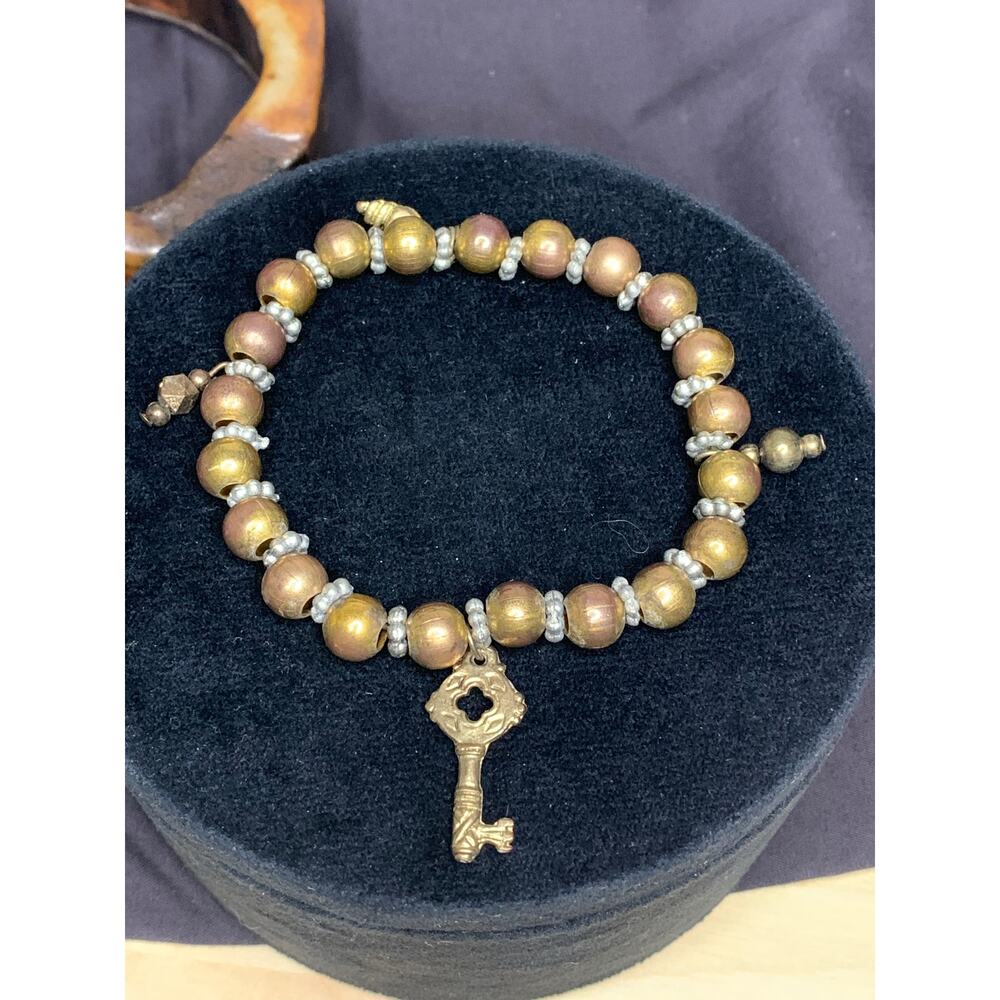 Brass beaded stretch jingle bracelet